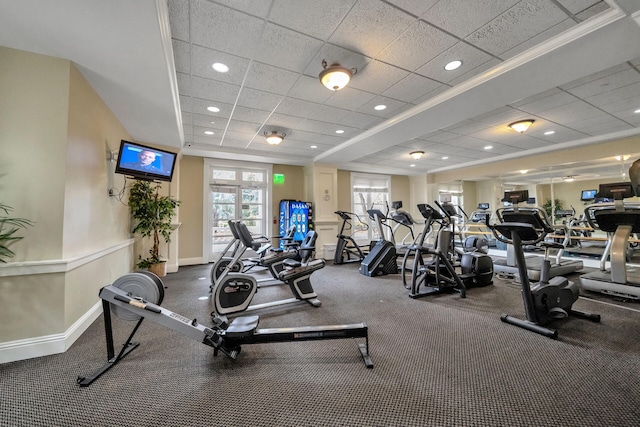 gym with ornamental molding and a drop ceiling