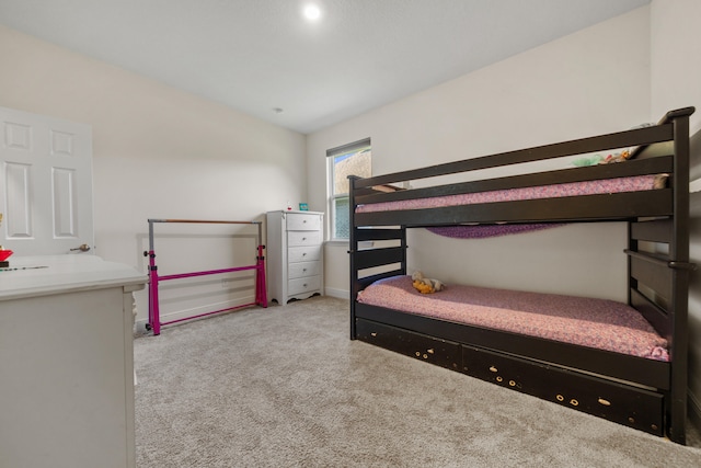 carpeted bedroom with vaulted ceiling