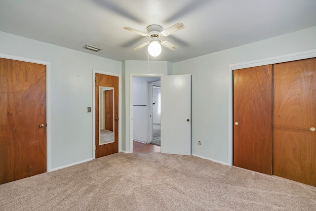 unfurnished bedroom featuring a closet, carpet, and ceiling fan