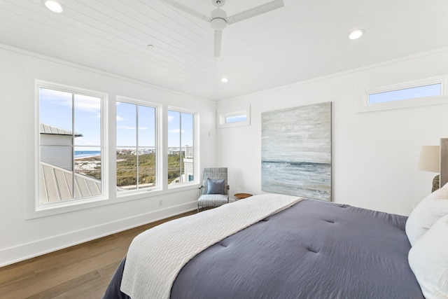 bedroom featuring a water view, ceiling fan, and dark hardwood / wood-style flooring