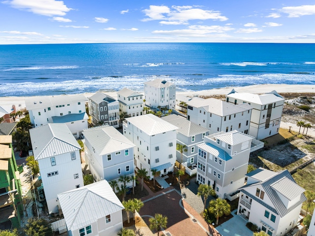 bird's eye view featuring a water view and a view of the beach