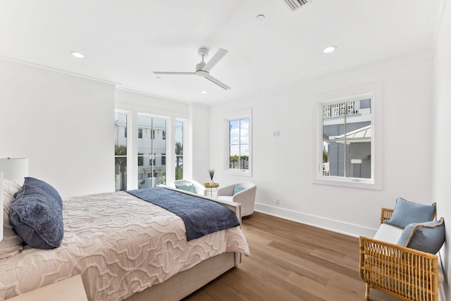 bedroom with wood-type flooring, crown molding, access to outside, and ceiling fan