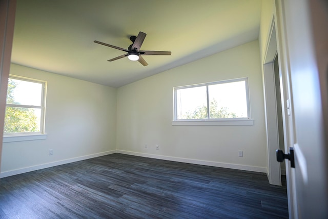 unfurnished room with lofted ceiling, dark hardwood / wood-style flooring, and ceiling fan