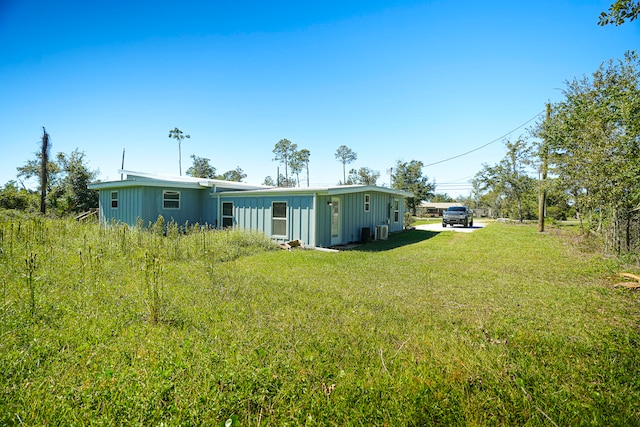 view of yard featuring central air condition unit