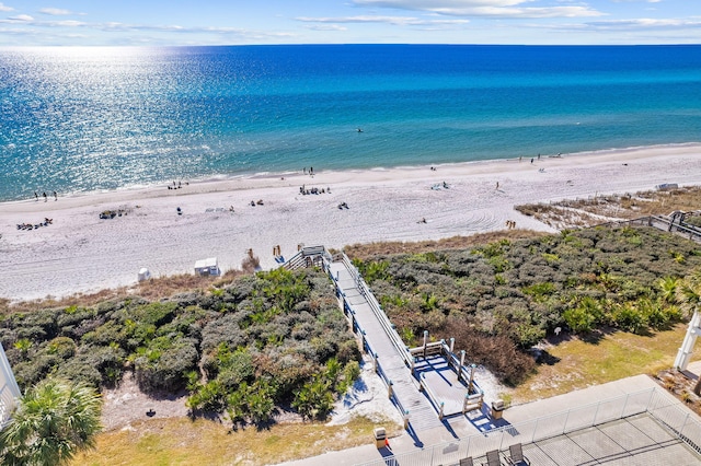 drone / aerial view featuring a view of the beach and a water view