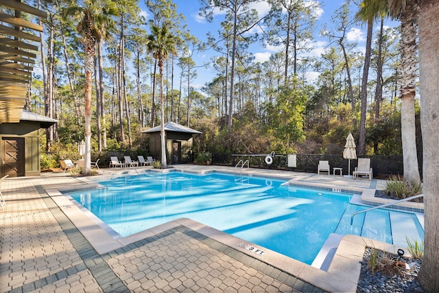 view of swimming pool with a gazebo and a patio