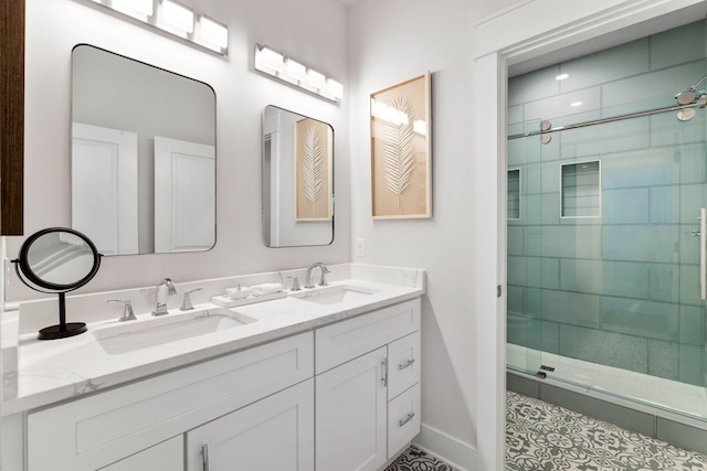 bathroom with a shower with door and vanity