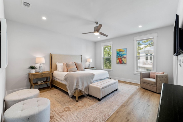 bedroom featuring light wood-type flooring and ceiling fan