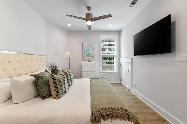 bedroom featuring ceiling fan and hardwood / wood-style flooring