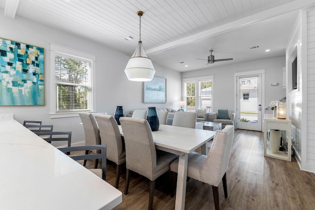 dining area featuring wooden ceiling, beam ceiling, ceiling fan, and hardwood / wood-style flooring