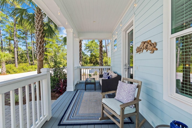 wooden deck featuring covered porch