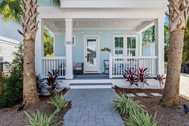 doorway to property featuring covered porch