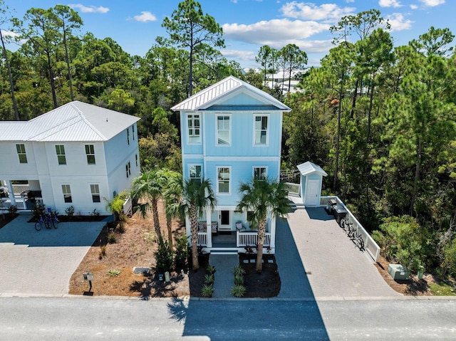 view of front of house featuring a storage shed