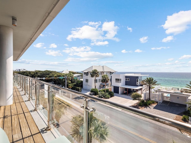 balcony featuring a water view