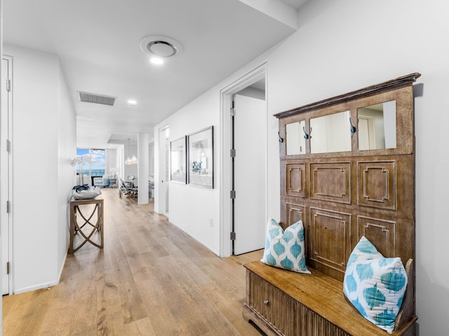 hall with light hardwood / wood-style flooring