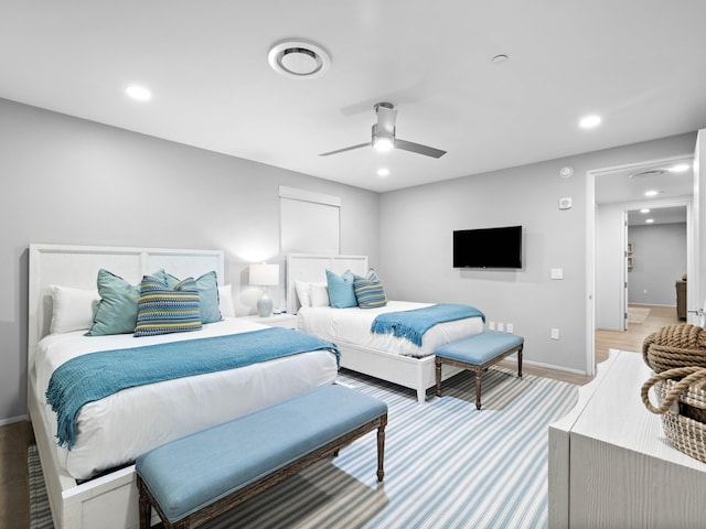 bedroom featuring ceiling fan and hardwood / wood-style floors