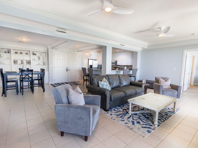 tiled living room featuring ceiling fan and crown molding