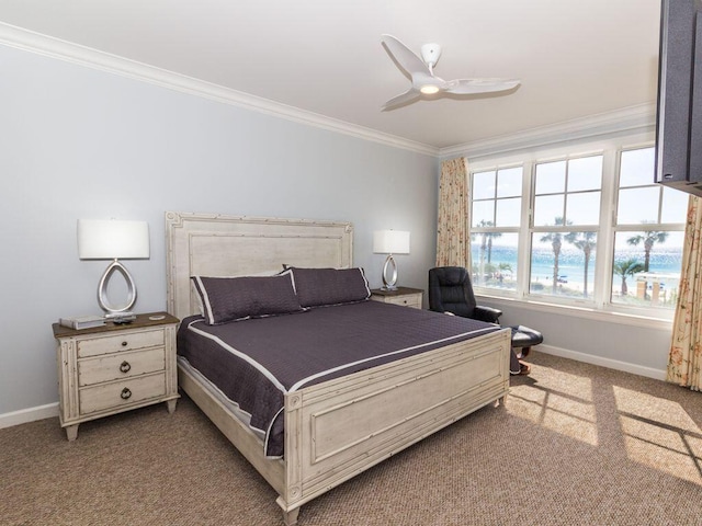 carpeted bedroom with ornamental molding and ceiling fan