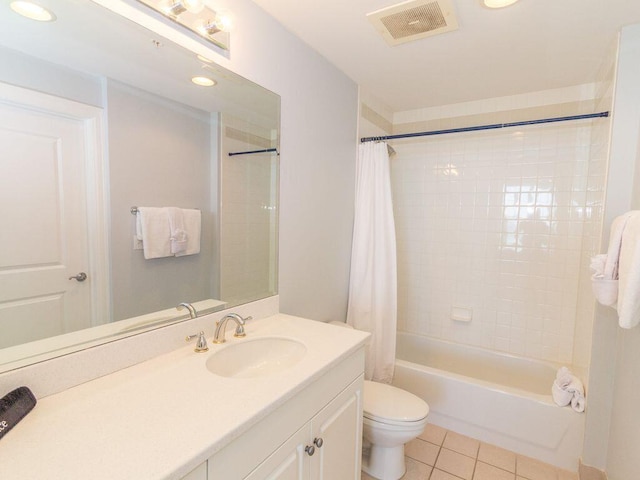 full bathroom with vanity, toilet, shower / bath combo with shower curtain, and tile patterned floors