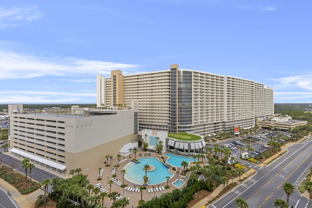 view of building exterior with a community pool