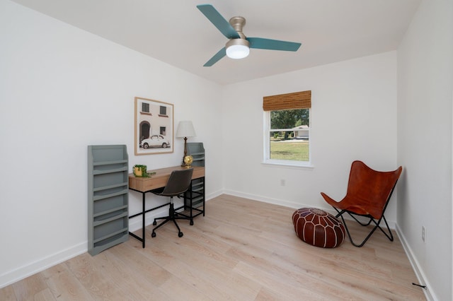 home office with ceiling fan and light wood-type flooring