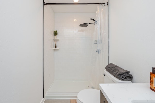 bathroom featuring vanity, a shower with curtain, and toilet