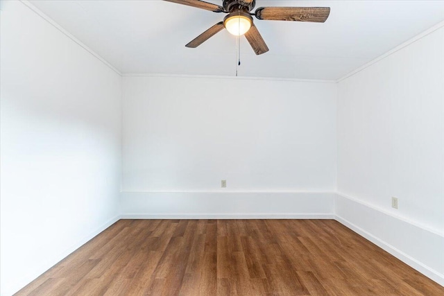 empty room featuring crown molding, ceiling fan, and wood-type flooring