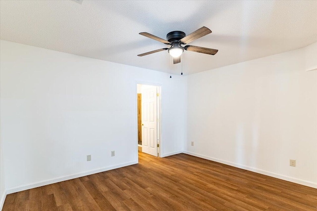 empty room featuring hardwood / wood-style floors, a textured ceiling, and ceiling fan