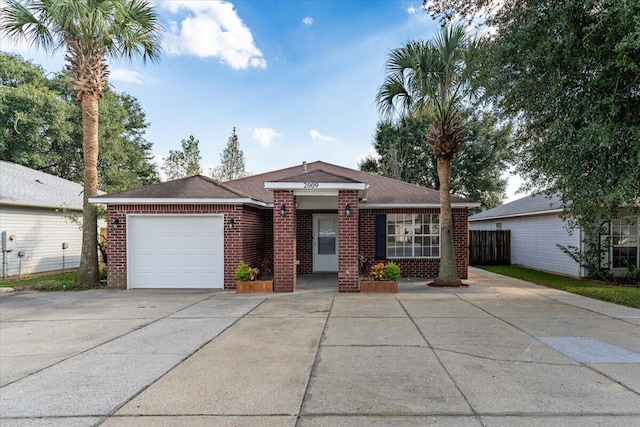 ranch-style home featuring a garage