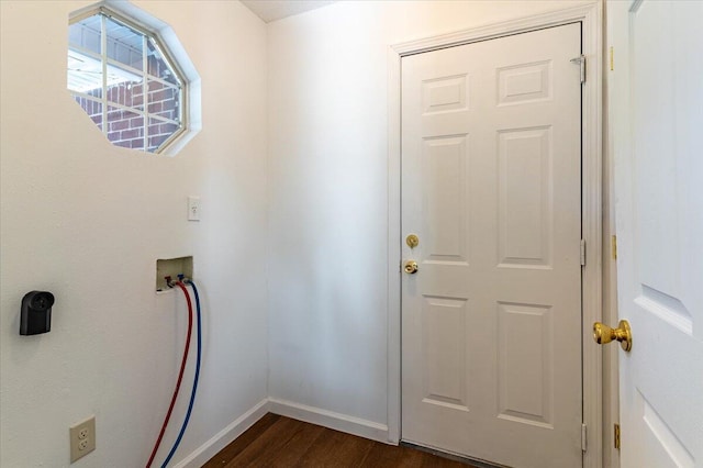 washroom featuring hookup for a washing machine and dark hardwood / wood-style floors