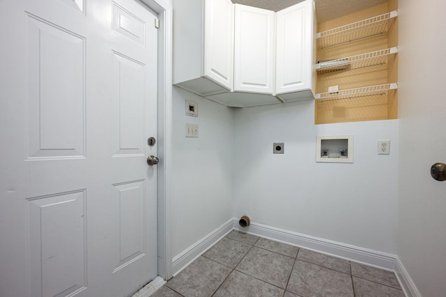 laundry area with washer hookup, cabinets, light tile patterned floors, and electric dryer hookup