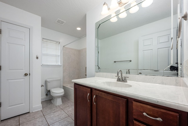 full bathroom featuring vanity, tile patterned flooring, toilet, and shower / washtub combination