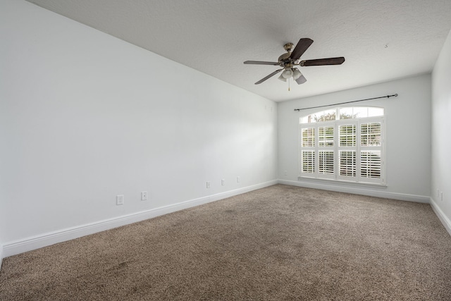 empty room featuring ceiling fan, carpet floors, and a textured ceiling