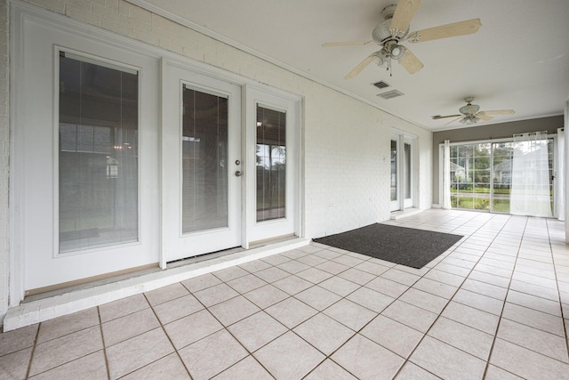 view of patio featuring ceiling fan