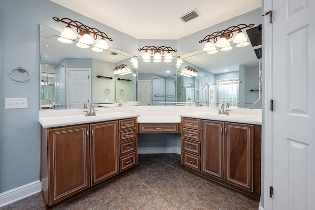 bathroom with vanity and tile patterned floors