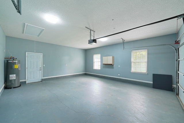 garage featuring a garage door opener and electric water heater