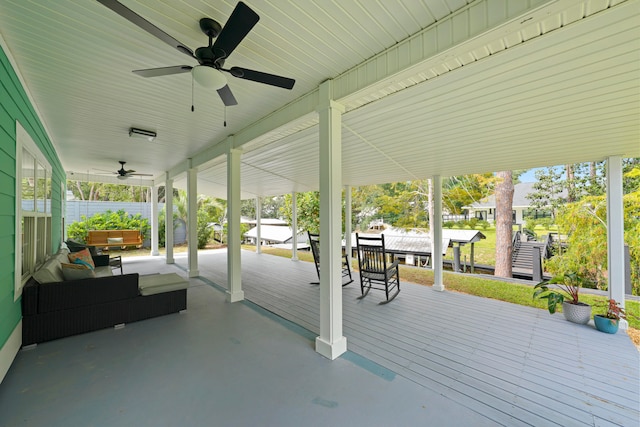 view of patio featuring ceiling fan and a wooden deck