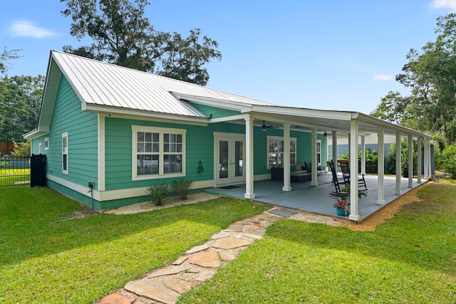 back of house with ceiling fan, french doors, a lawn, and a patio area