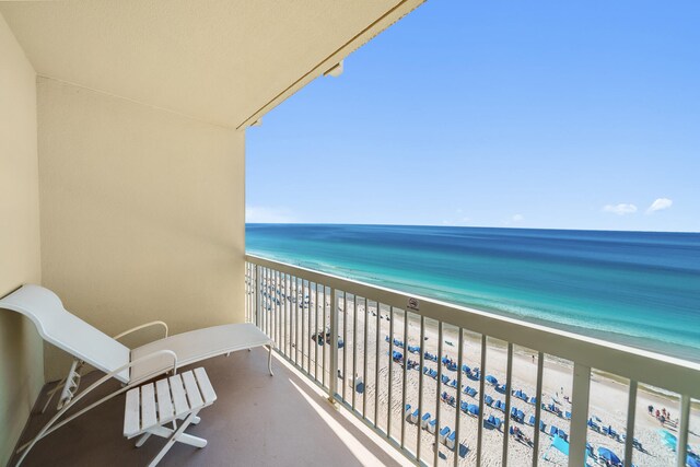 balcony with a beach view and a water view