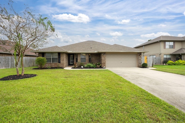 view of front facade featuring a front yard and a garage