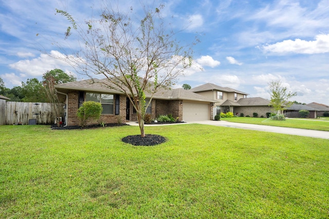 2826 Shoni Dr, Navarre, FL 32566 - view of front of home featuring fence, a front lawn, brick siding, a garage, and concrete driveway