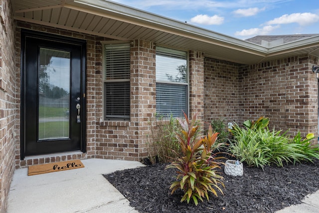 2826 Shoni Dr, Navarre, FL 32566 - view of exterior entry featuring brick siding