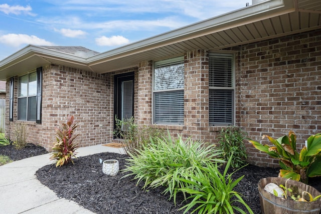 2826 Shoni Dr, Navarre, FL 32566 - view of exterior entry featuring brick siding