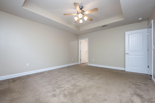 2826 Shoni Dr, Navarre, FL 32566 - spare room featuring ceiling fan, a raised ceiling, carpet, baseboards, and visible vents