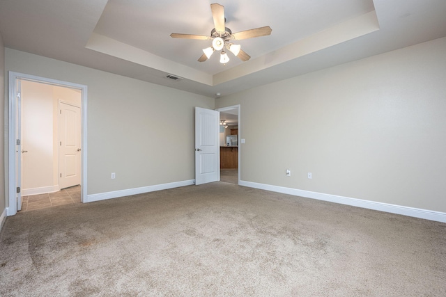 2826 Shoni Dr, Navarre, FL 32566 - unfurnished bedroom with baseboards, carpet flooring, a raised ceiling, and visible vents