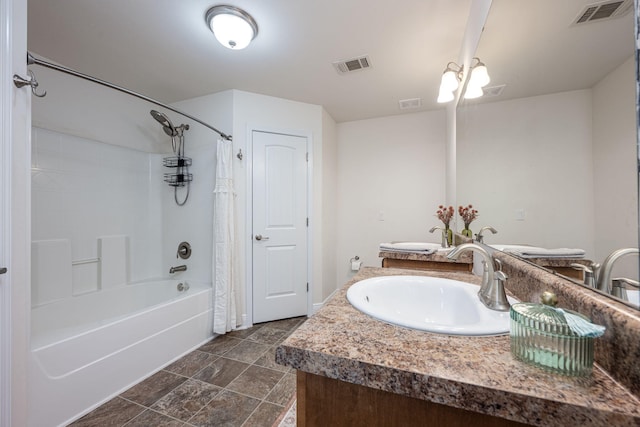 bathroom with vanity and shower / bath combo with shower curtain