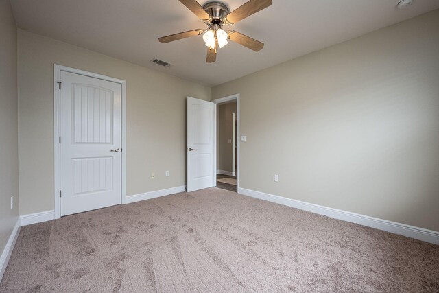 2826 Shoni Dr, Navarre, FL 32566 - unfurnished bedroom with a ceiling fan, baseboards, visible vents, and carpet