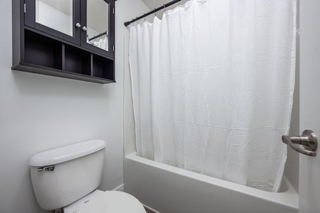 2826 Shoni Dr, Navarre, FL 32566 - bathroom featuring shower / bath combo with shower curtain and toilet