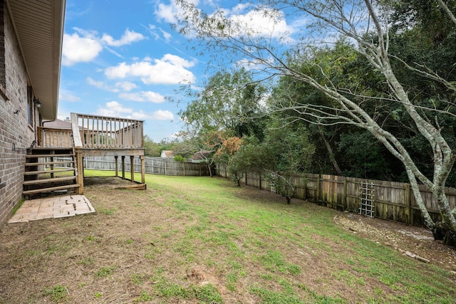 view of yard featuring a wooden deck