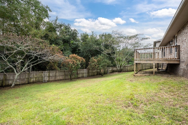 view of yard with a wooden deck